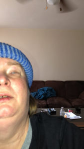 Amanda wearing a blue knit cap